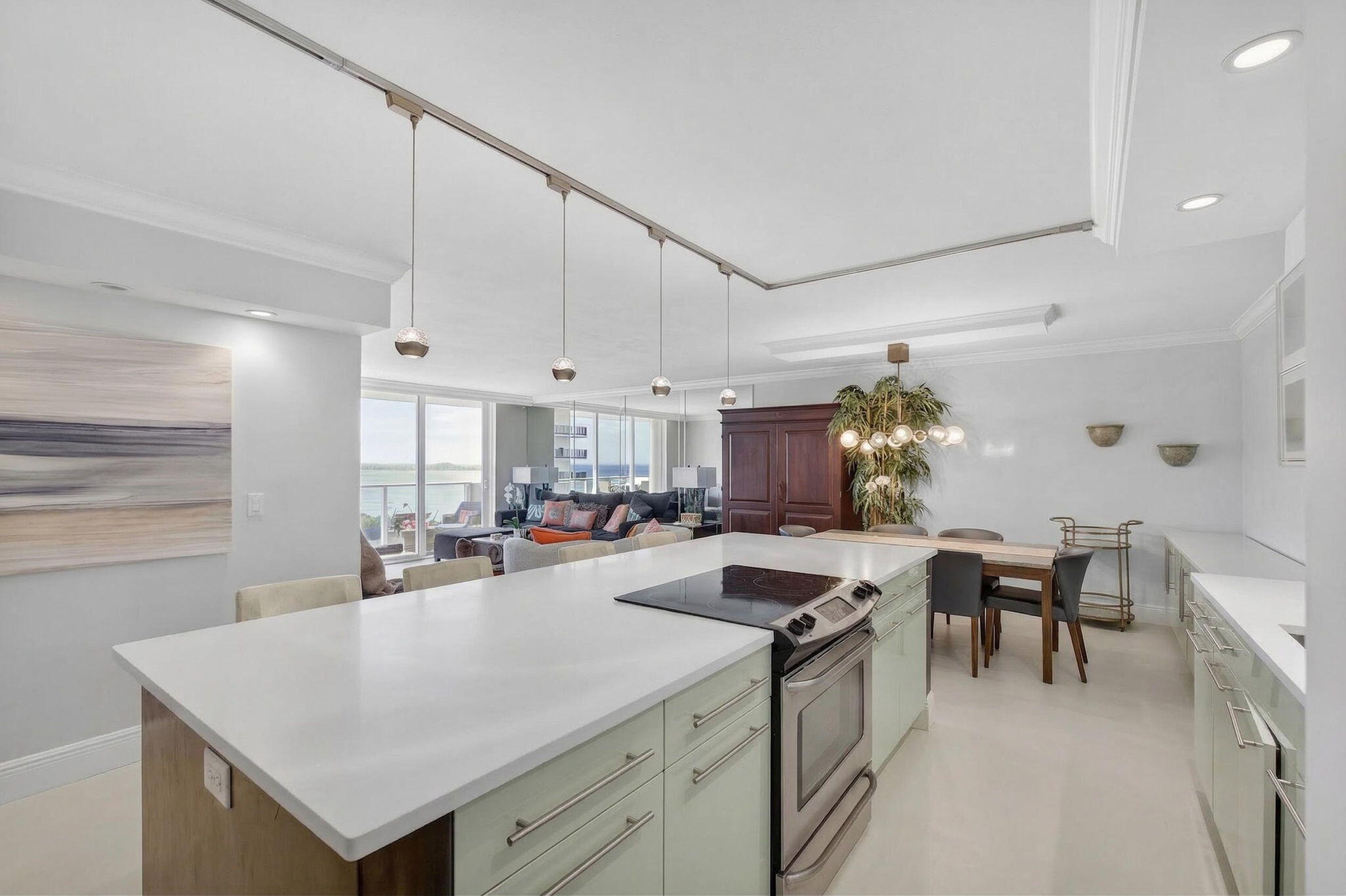 5440 North Ocean Drive, Unit 805 Singer Island, FL 33404 - Photo 10 of 56 a kitchen with sink cabinets and stove