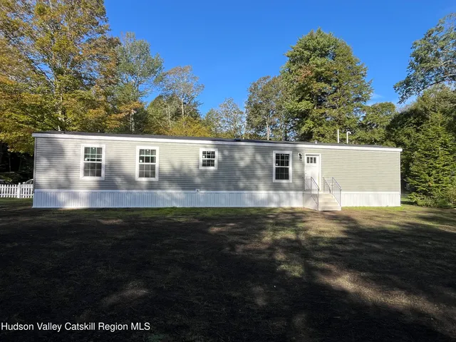 a view of a yard with a tree