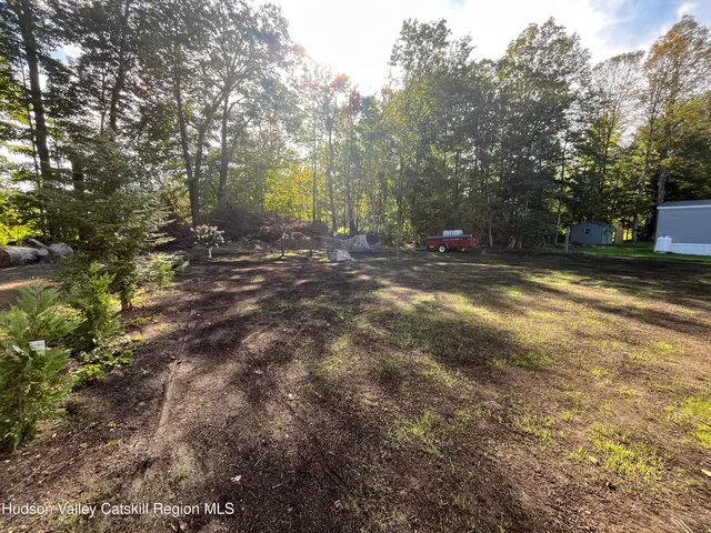 a backyard of a house with trampoline