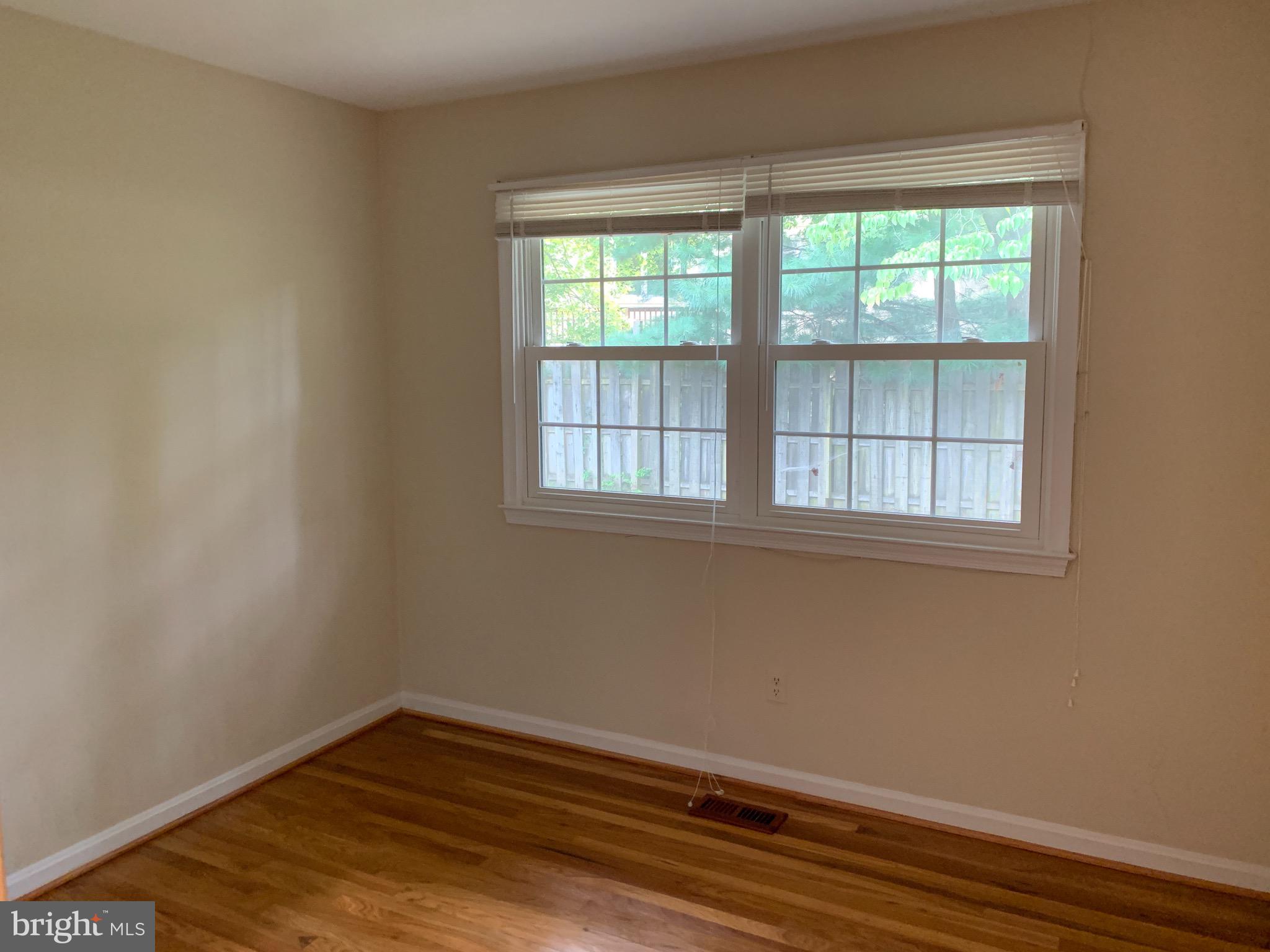 9700 Brookford Road Potomac, MD 20854 - Photo 17 of 27 wooden floor in an empty room with a window