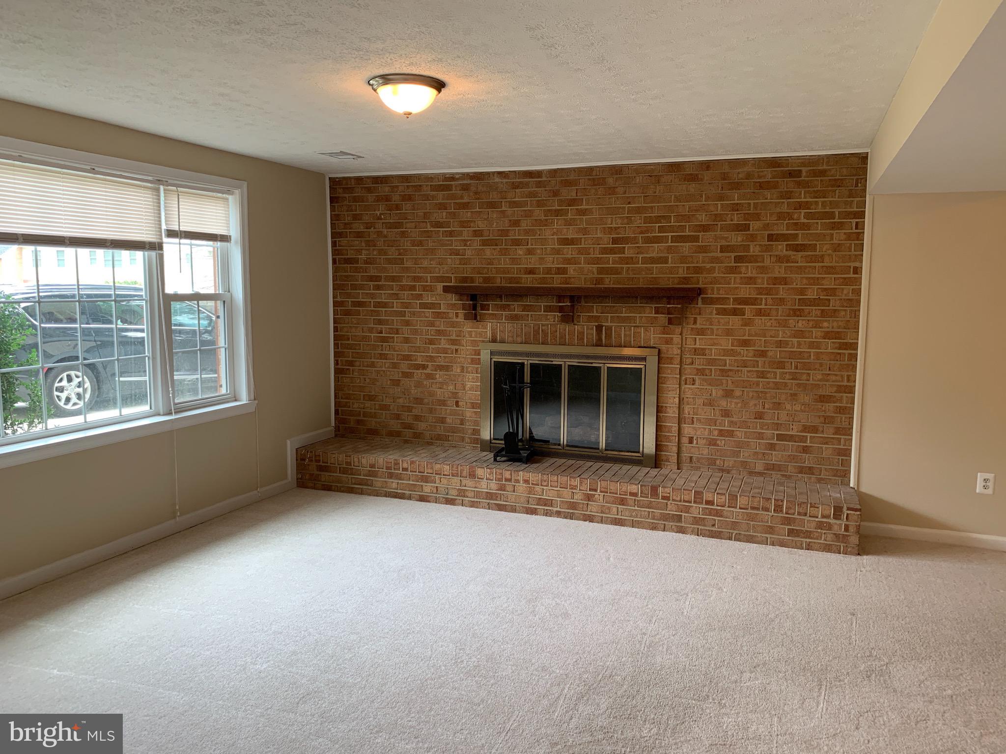 9700 Brookford Road Potomac, MD 20854 - Photo 23 of 27 a view of empty room with a fireplace