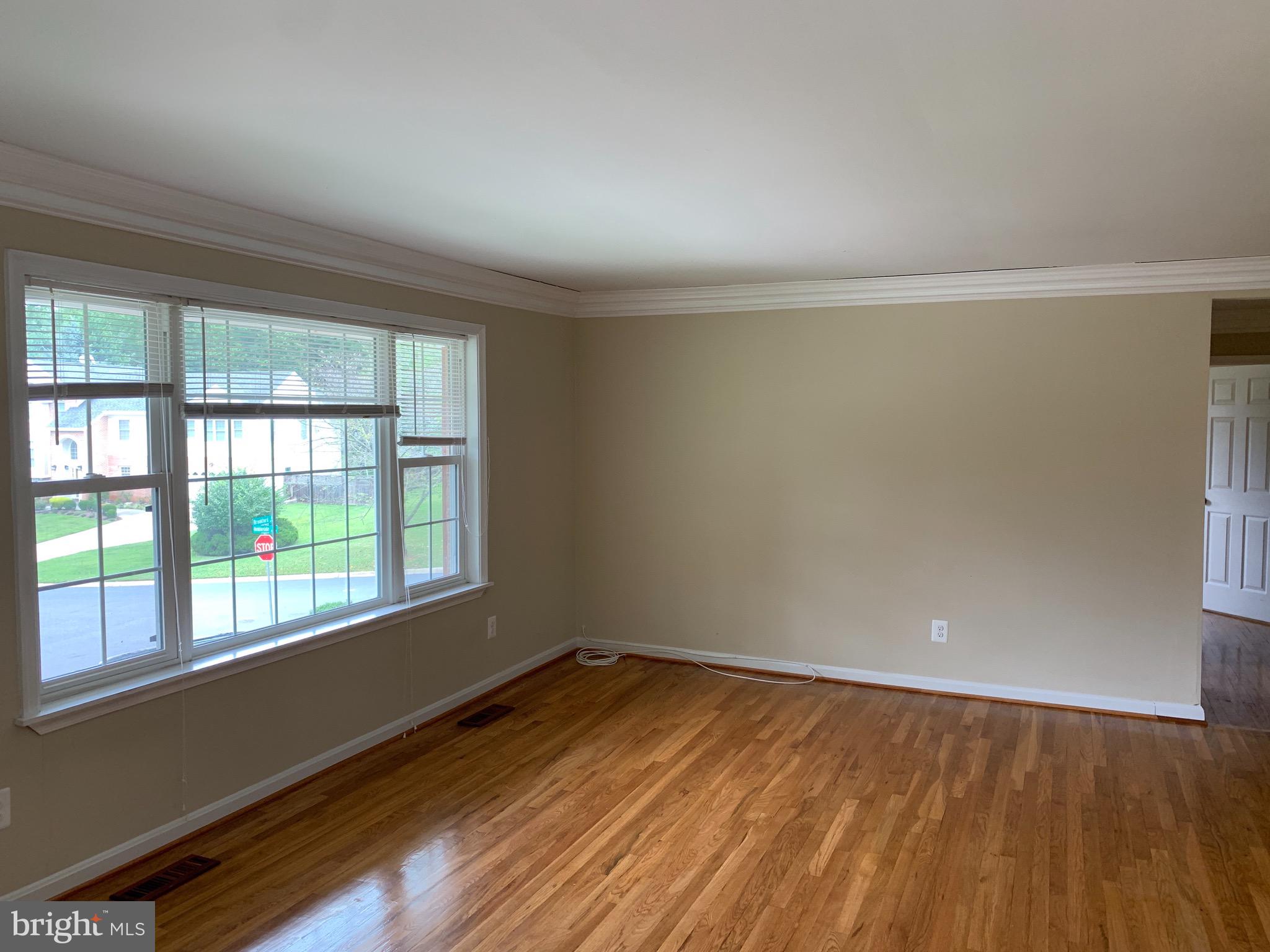 9700 Brookford Road Potomac, MD 20854 - Photo 8 of 27 wooden floor in an empty room with a window