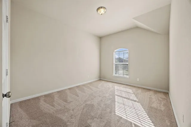 a view of an empty room with window