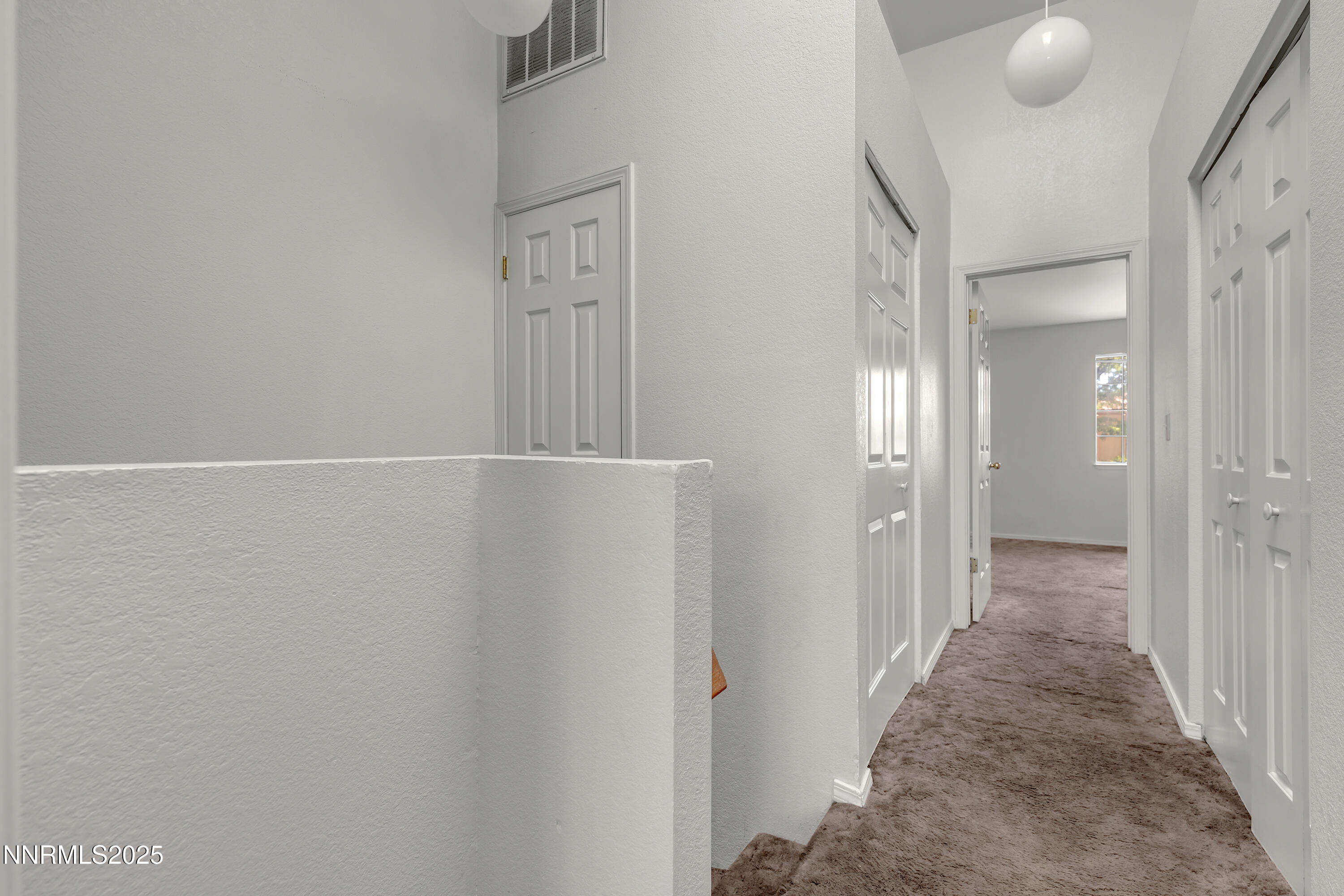 2650 Plumas Street, Unit 11 Reno, NV 89509 - Photo 20 of 33 a view of a hallway with wooden floor