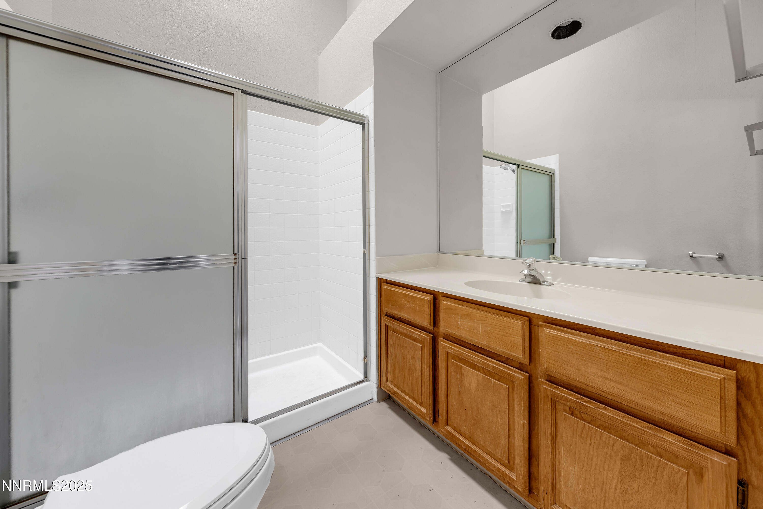 2650 Plumas Street, Unit 11 Reno, NV 89509 - Photo 26 of 33 a bathroom with a sink a toilet and shower