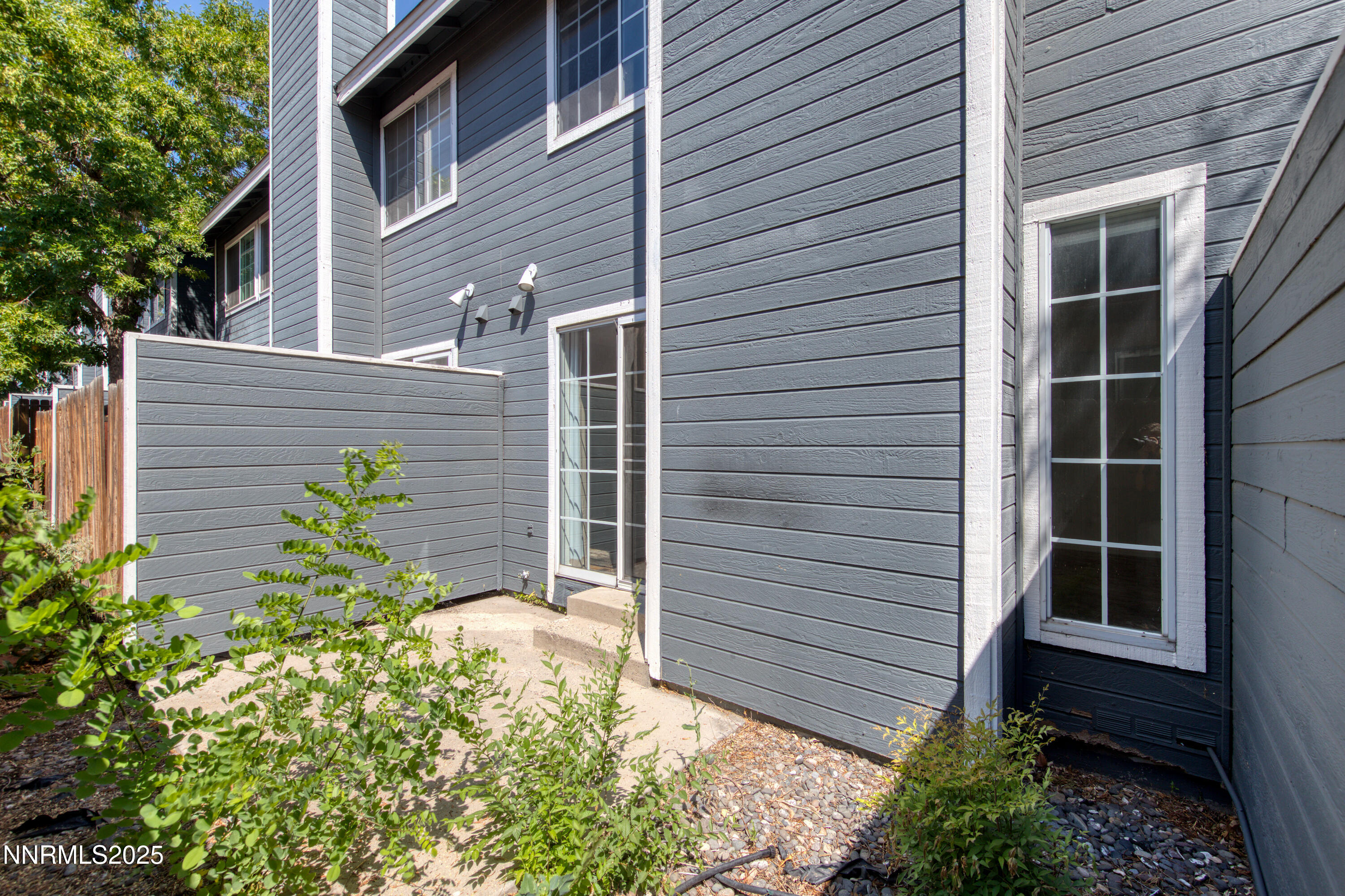 2650 Plumas Street, Unit 11 Reno, NV 89509 - Photo 30 of 33 a view of yellow house with a yard and potted plants