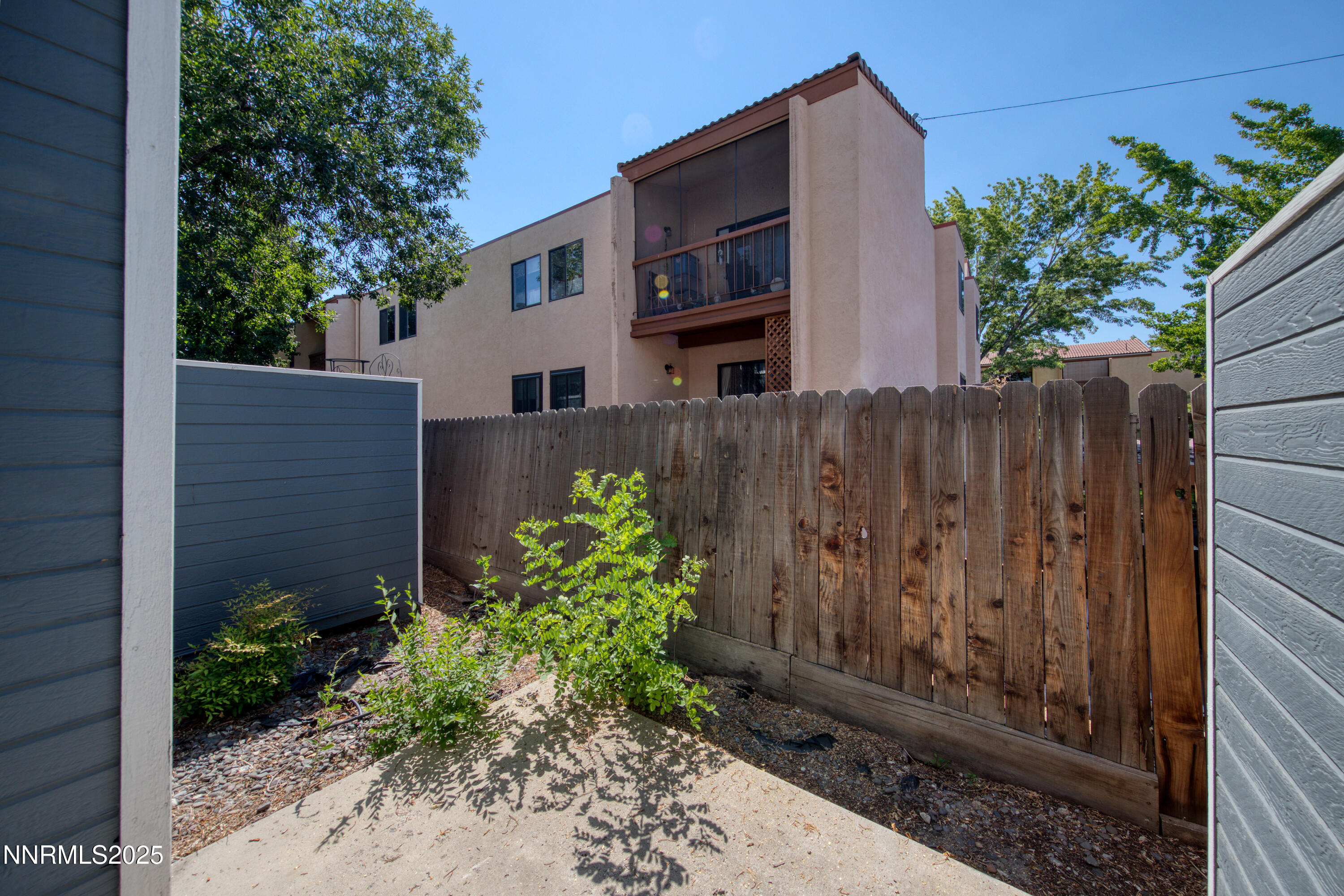 2650 Plumas Street, Unit 11 Reno, NV 89509 - Photo 32 of 33 a view of a house with a wooden fence