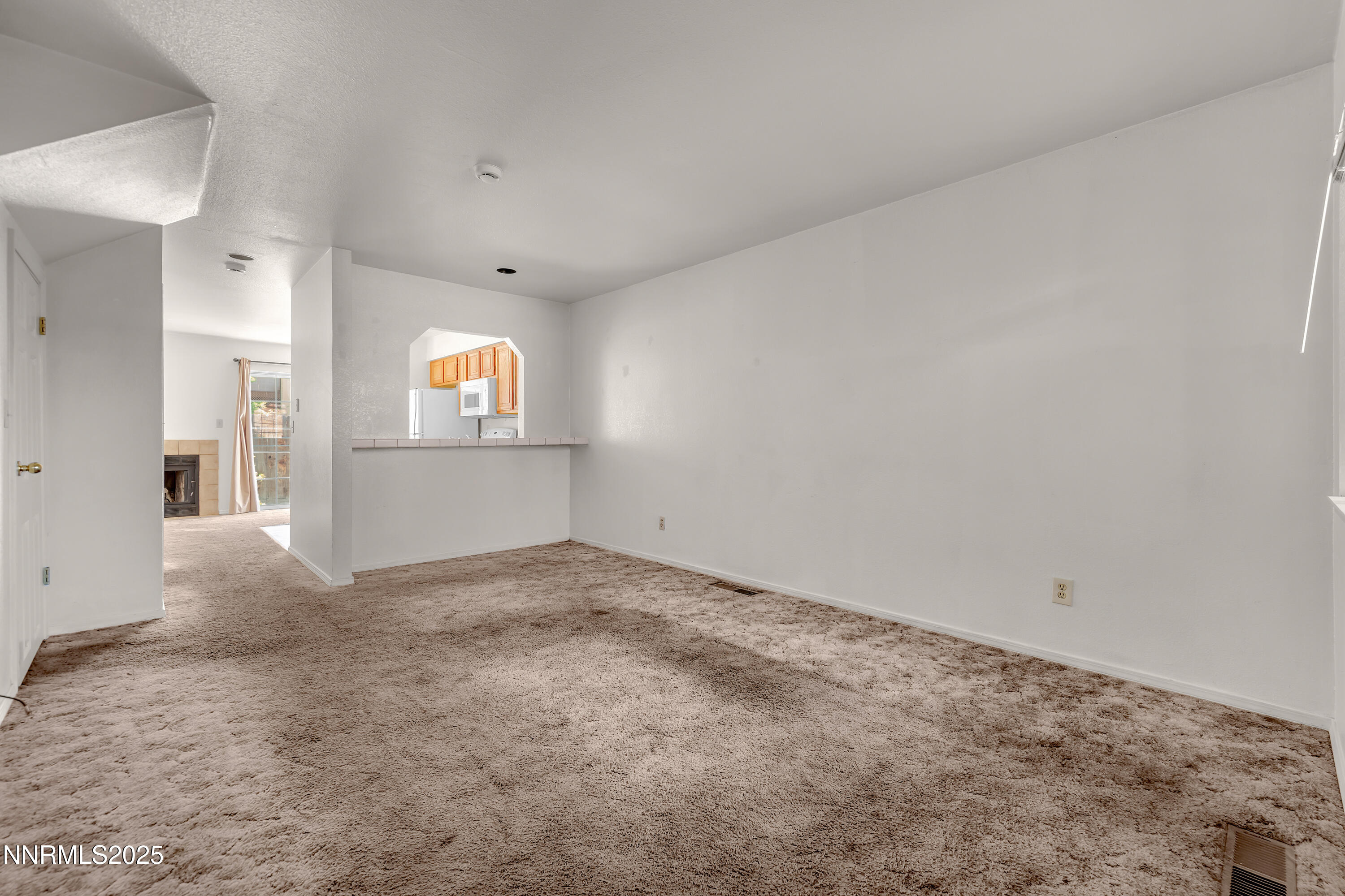 2650 Plumas Street, Unit 11 Reno, NV 89509 - Photo 5 of 33 a view of a big room with wooden floor and windows
