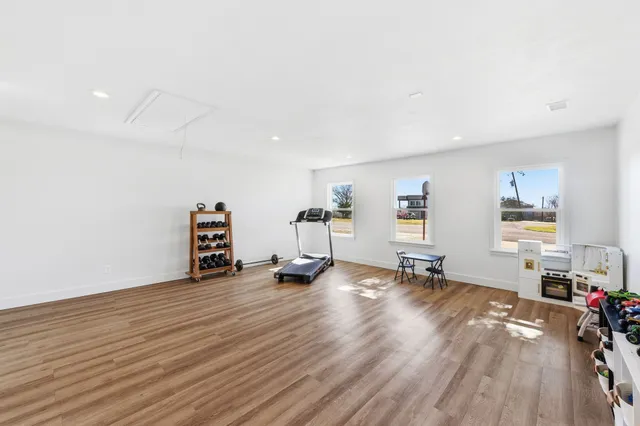 a room with furniture and wooden floor
