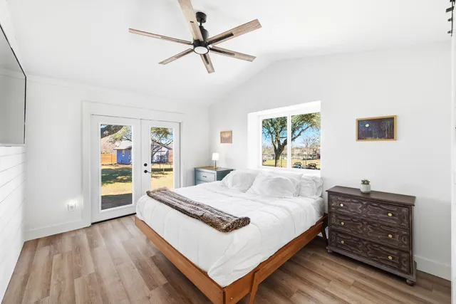 a bedroom with a bed and a bookshelf