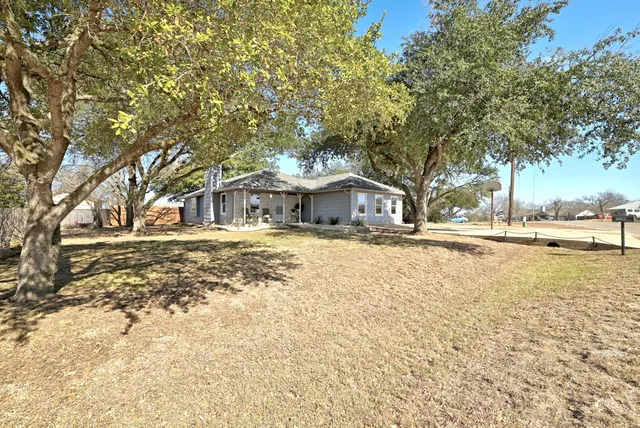 a house with trees in front of it