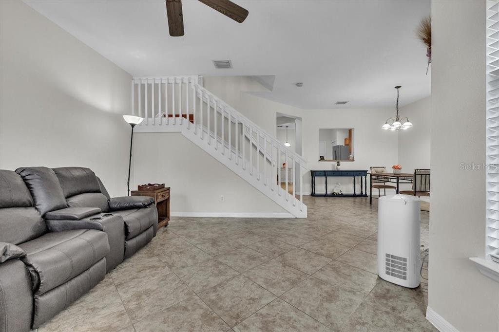3954 Cherrybrook Loop Fort Myers, FL 33966 - Photo 12 of 47 a living room with furniture and kitchen view