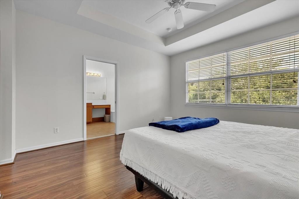 3954 Cherrybrook Loop Fort Myers, FL 33966 - Photo 24 of 47 a bedroom with a bed and a large window