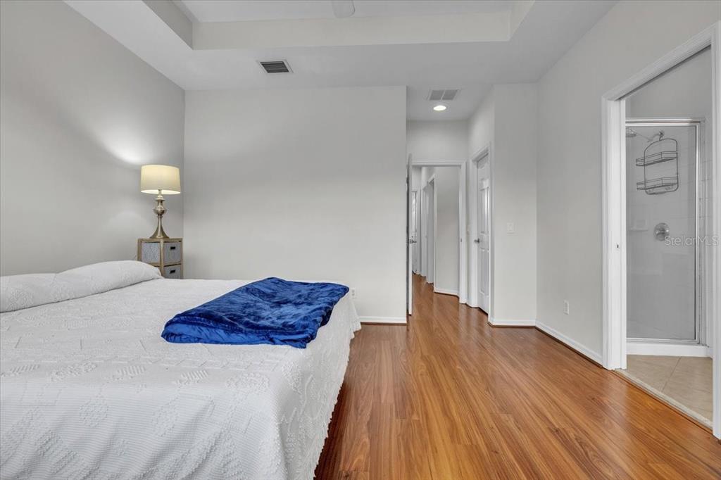 3954 Cherrybrook Loop Fort Myers, FL 33966 - Photo 25 of 47 a bedroom with a bed and a lamp on table