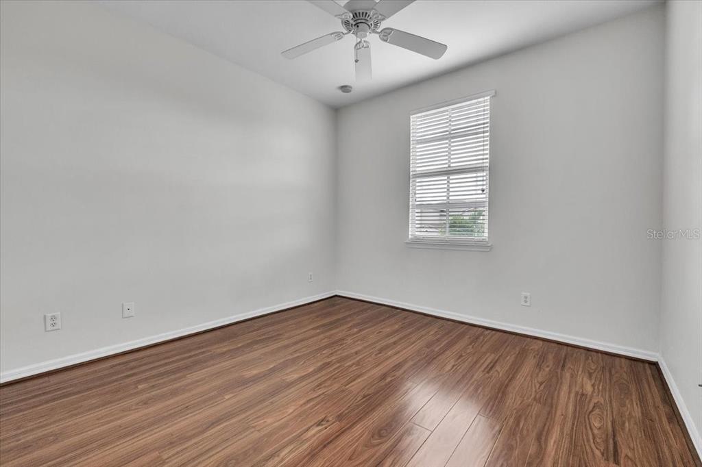 3954 Cherrybrook Loop Fort Myers, FL 33966 - Photo 28 of 47 wooden floor in an empty room with a window