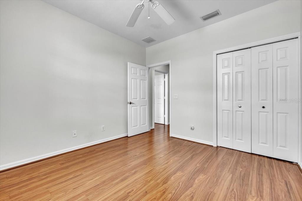 3954 Cherrybrook Loop Fort Myers, FL 33966 - Photo 29 of 47 a view of an empty room with wooden floor