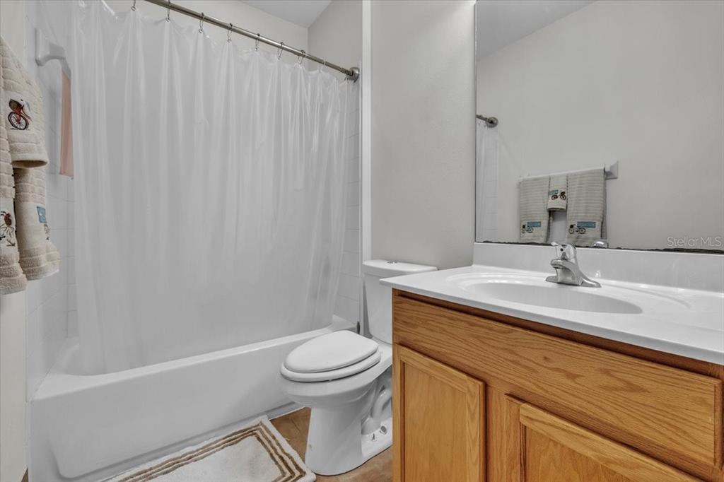 3954 Cherrybrook Loop Fort Myers, FL 33966 - Photo 30 of 47 a bathroom with a granite countertop sink toilet and shower