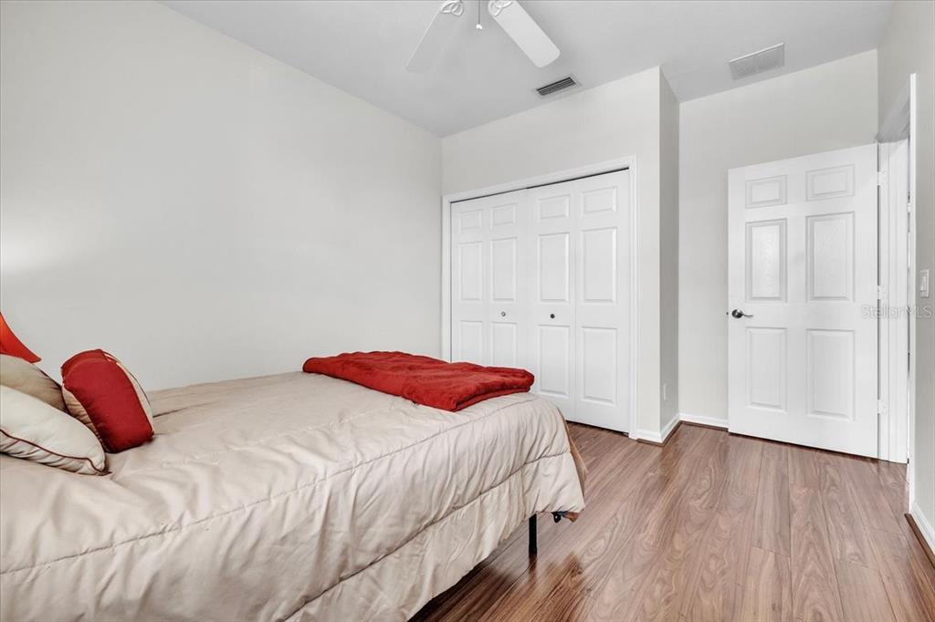 3954 Cherrybrook Loop Fort Myers, FL 33966 - Photo 32 of 47 a bedroom with a bed and a walk in closet