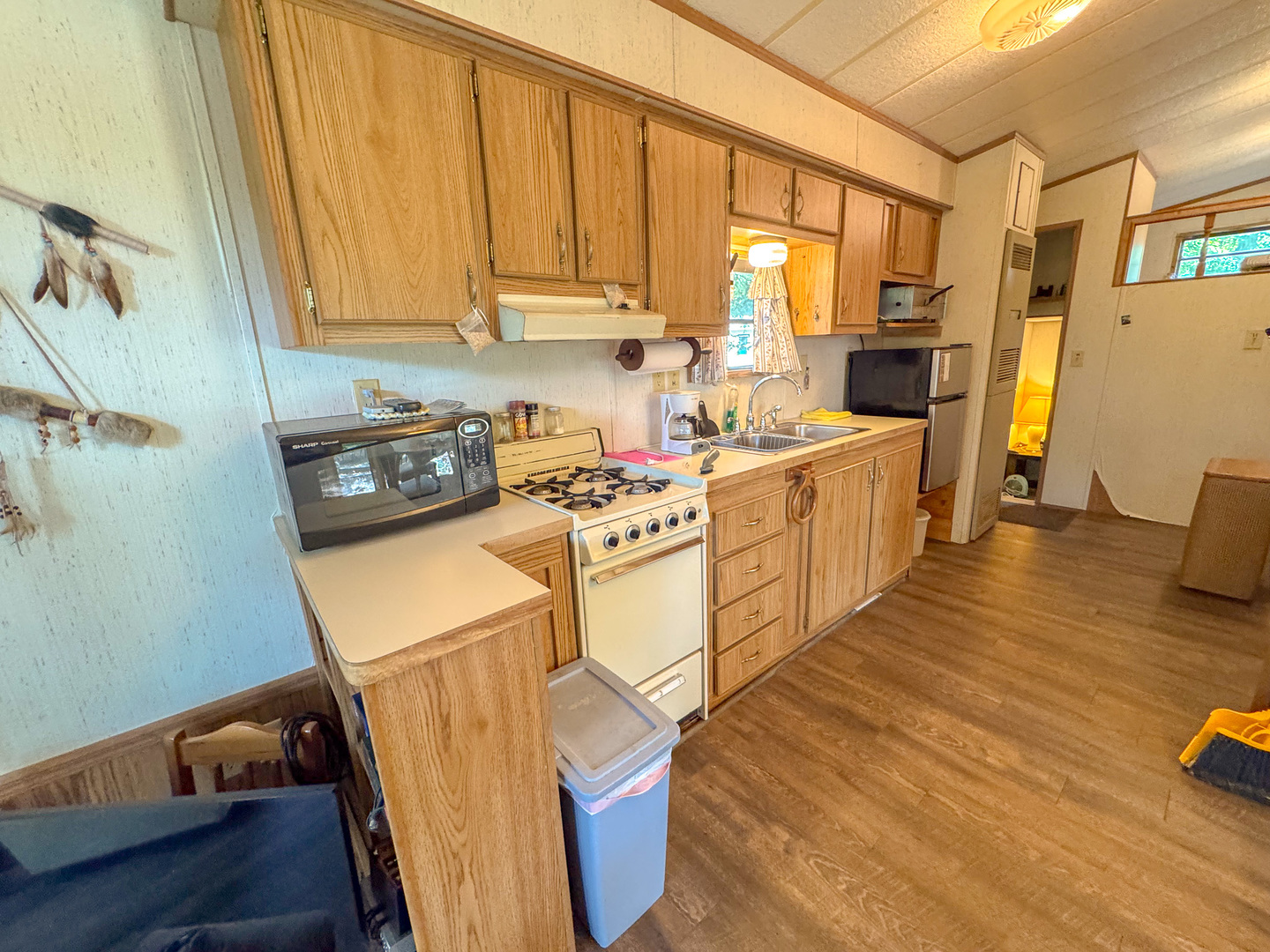 5-58 Woodhaven Sublette, IL 61367 - Photo 9 of 16 a kitchen with wooden cabinets and sink