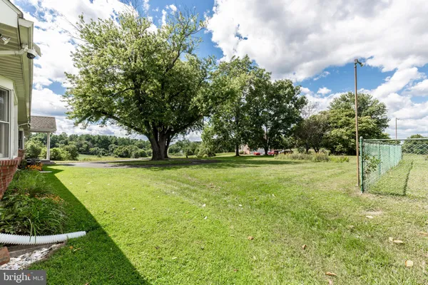 a house with trees in the background