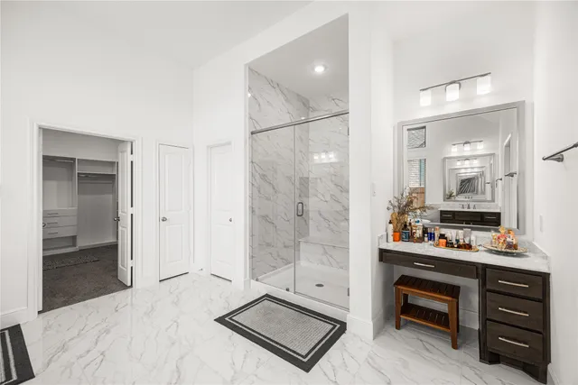 a room with a bed and a mirror