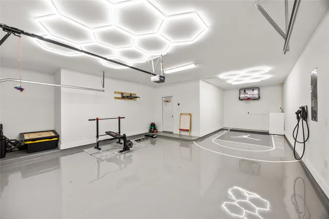 a room with gym equipment and a view of living room