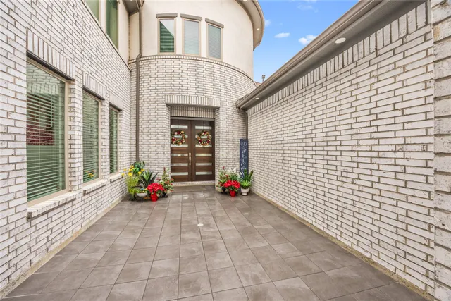 a view of entryway with flower pots