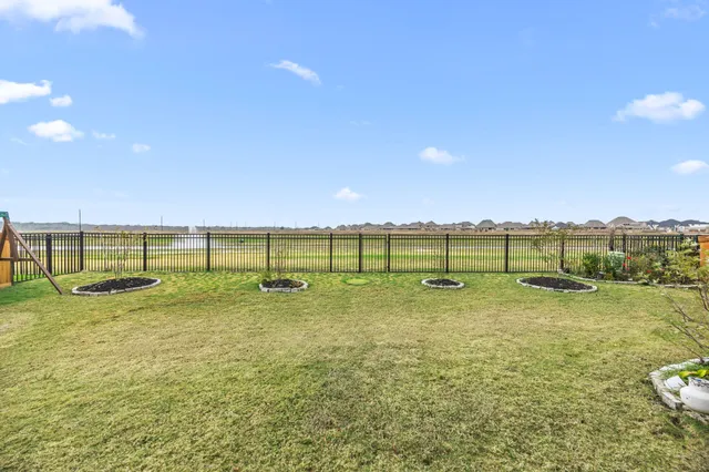 a view of a yard with a lake