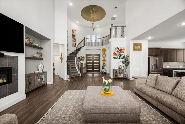 a living room with furniture and a fireplace