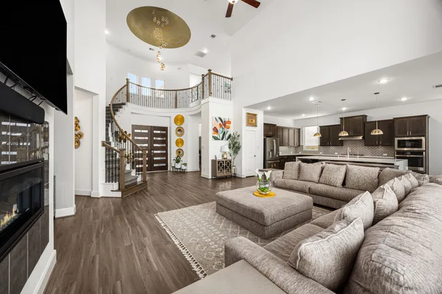 a living room with fireplace furniture and a flat screen tv