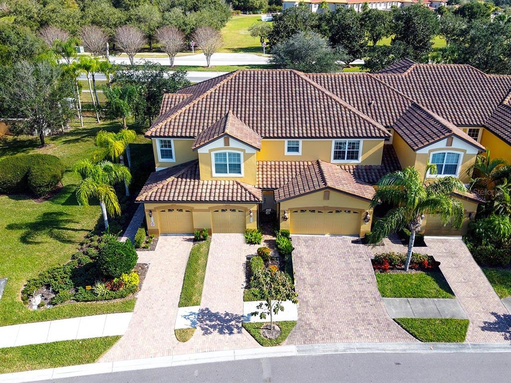 8113 Miramar Way, Unit 201 Lakewood Ranch, FL 34202 - Photo 1 of 1 an aerial view of a house having yard and patio
