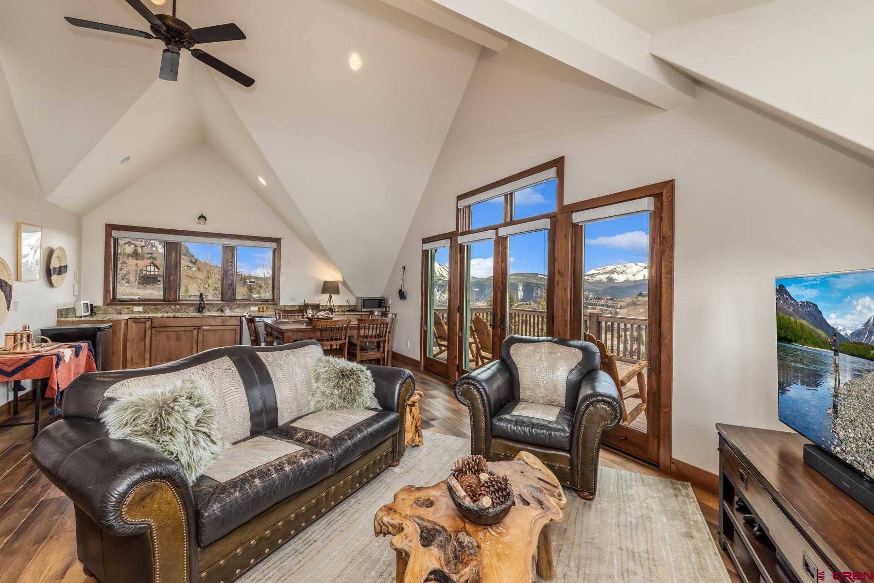 32 Cinnamon Mountain Road Crested Butte, CO 81225 - Photo 30 of 44 a living room with furniture and a floor to ceiling window