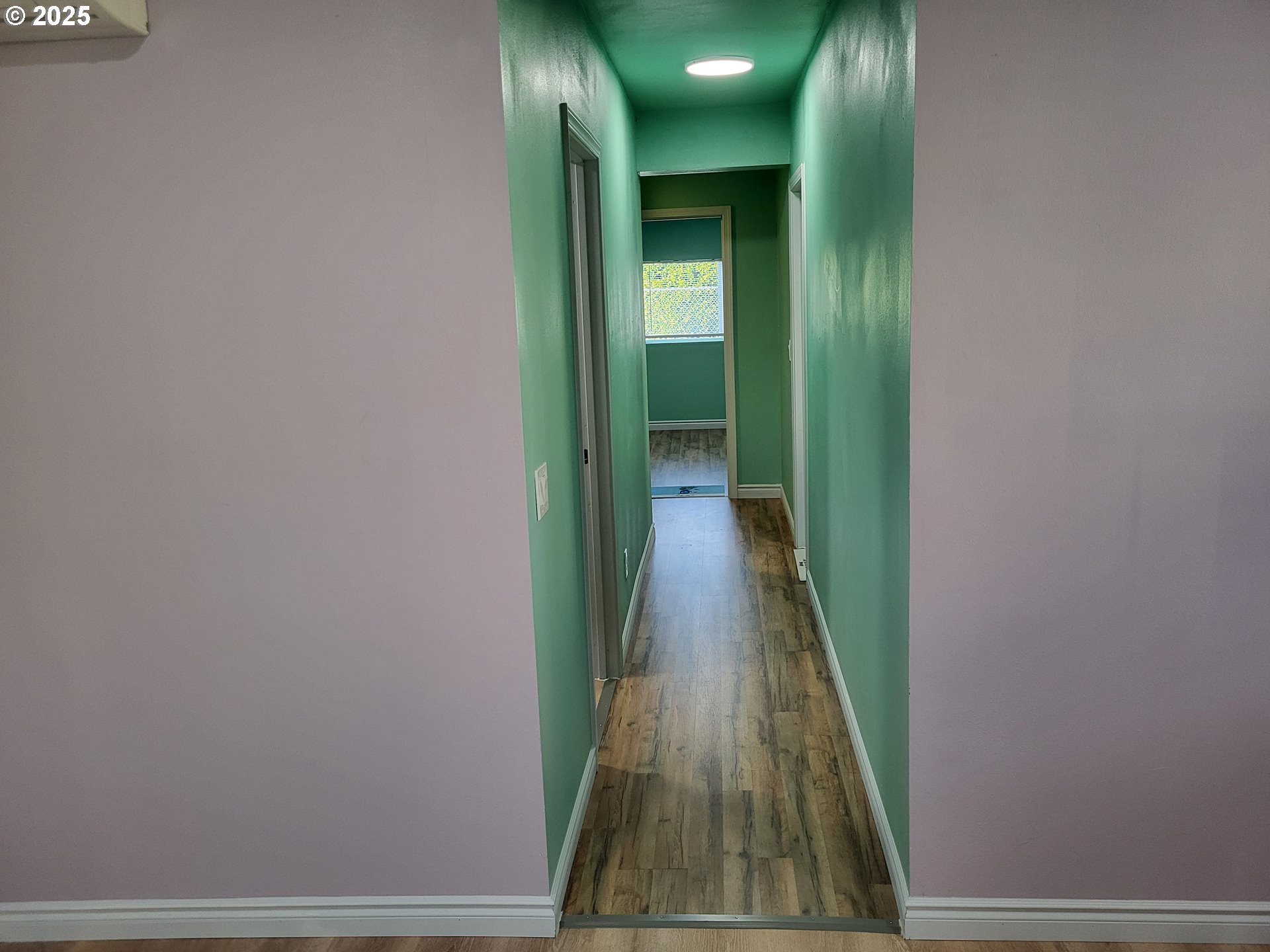 811 Laurel Avenue Reedsport, OR 97467 - Photo 12 of 34 a view of a hallway with wooden floor