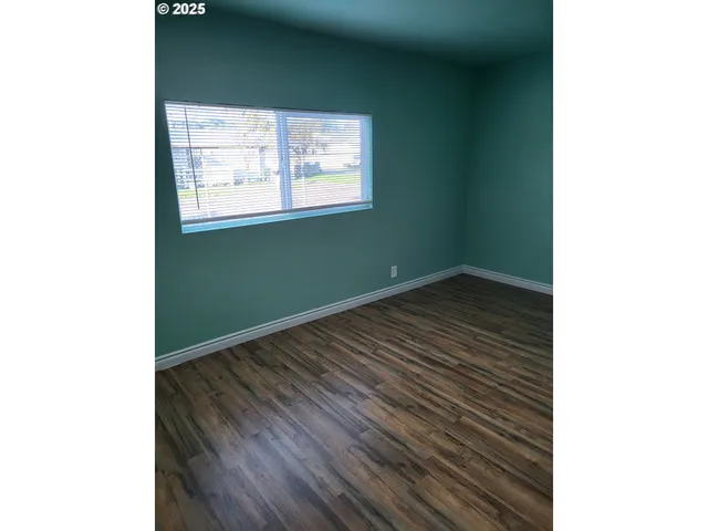 a view of a room that has a window in it