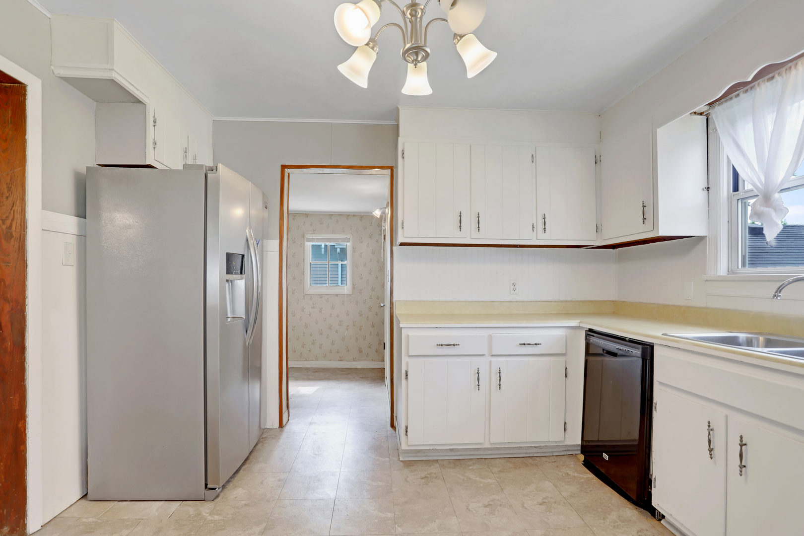 812 East Webster Street Clinton, IL 61727 - Photo 13 of 26 a view of cabinets a sink and a stove in a kitchen