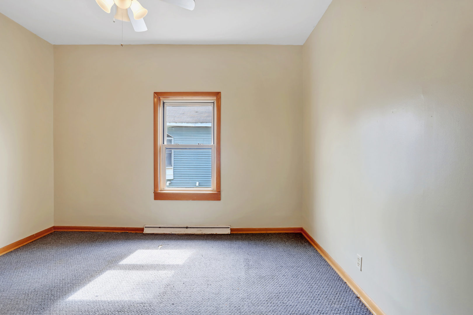 812 East Webster Street Clinton, IL 61727 - Photo 17 of 26 a view of an empty room with a window