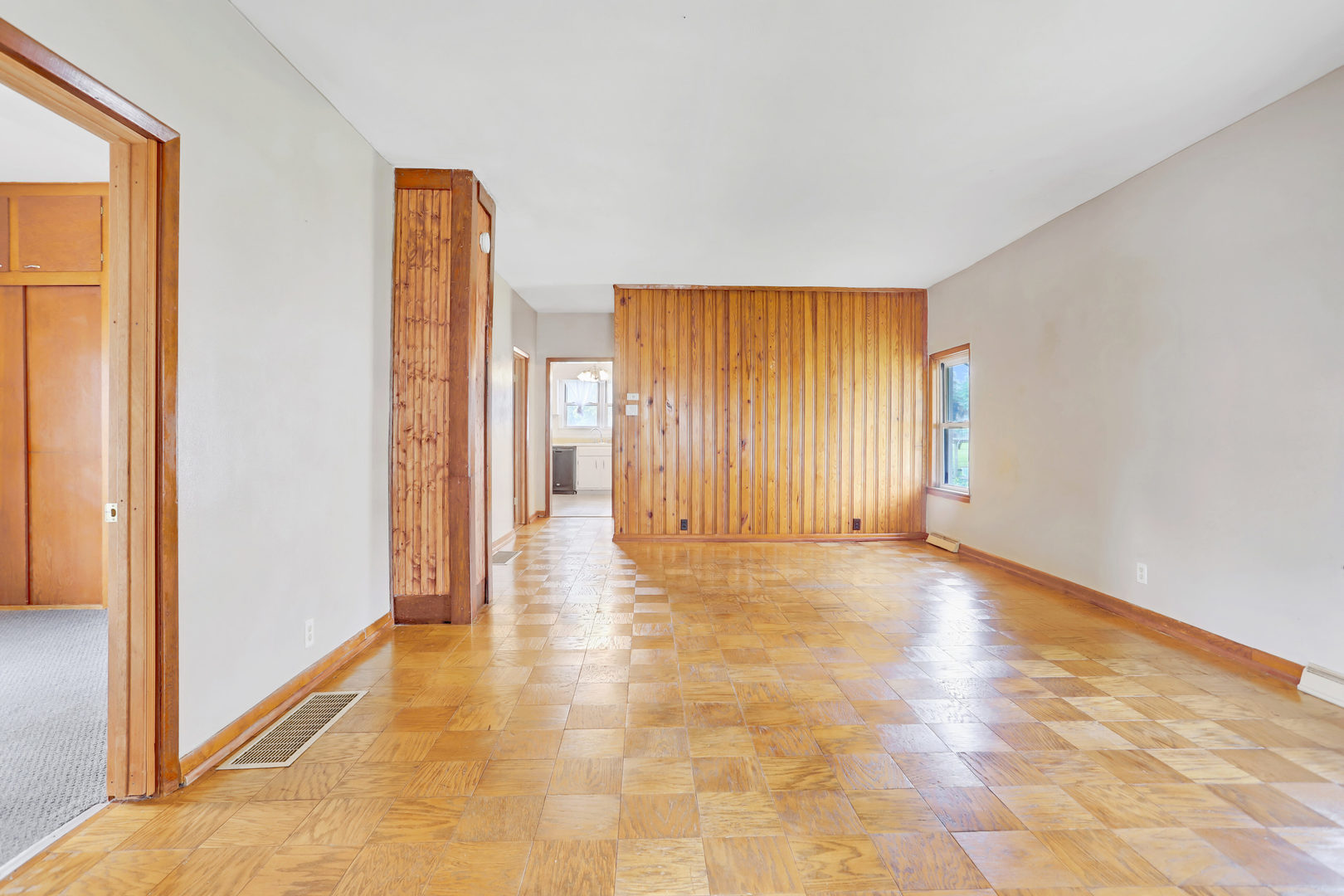 812 East Webster Street Clinton, IL 61727 - Photo 8 of 26 a view of a room with a door and wooden floor
