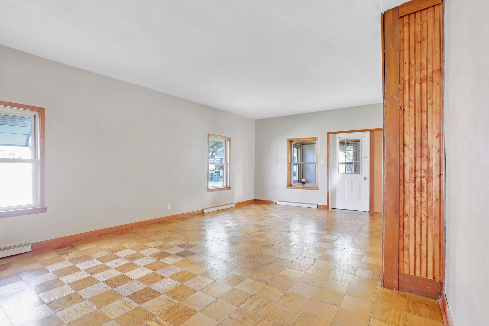 812 East Webster Street Clinton, IL 61727 - Photo 10 of 26 a view of an empty room with window and wooden floor