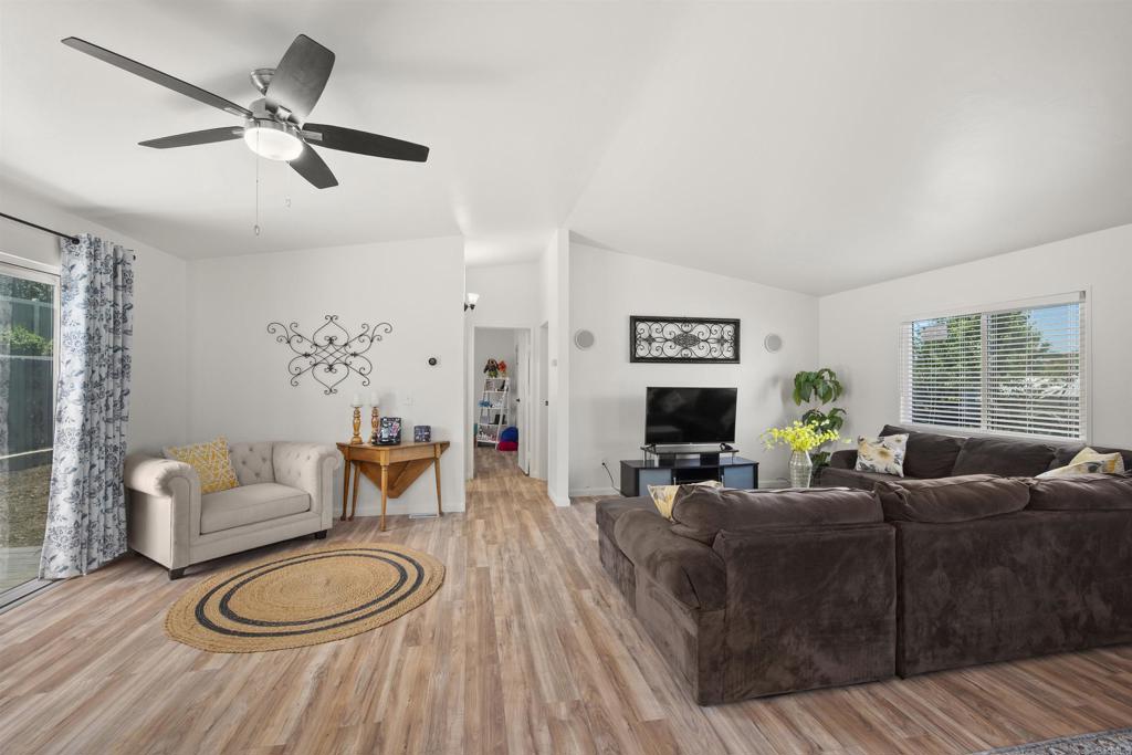 8620 Atlas View Drive Santee, CA 92071 - Photo 14 of 58 a living room with furniture a fireplace and a window