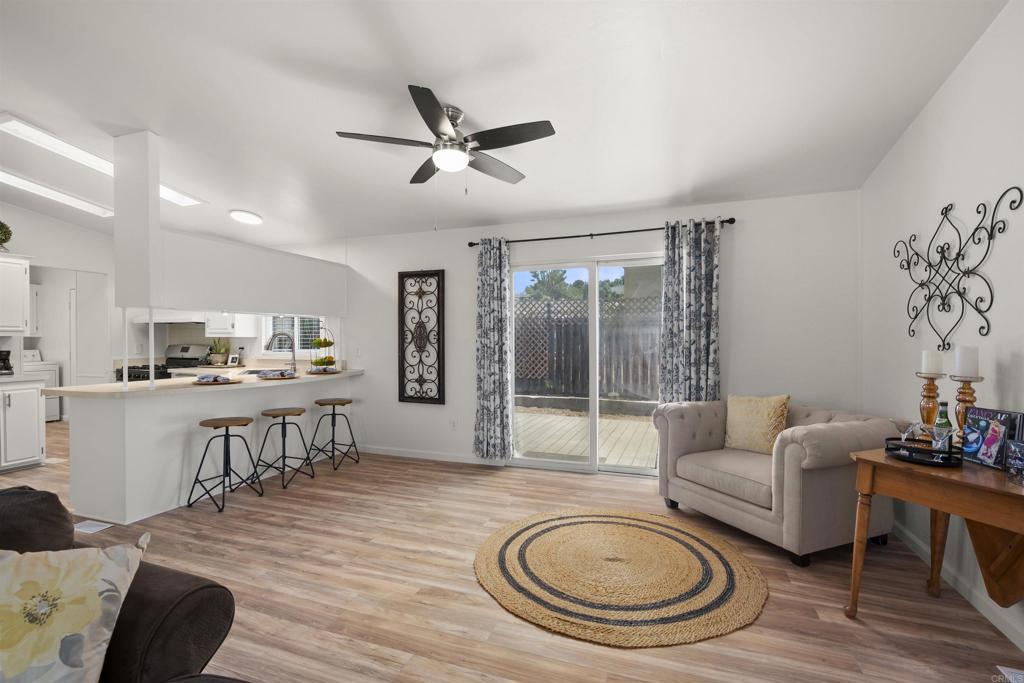 8620 Atlas View Drive Santee, CA 92071 - Photo 17 of 58 a living room with furniture and a wooden floor