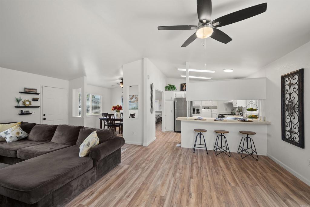 8620 Atlas View Drive Santee, CA 92071 - Photo 18 of 58 a living room with furniture and a wooden floor