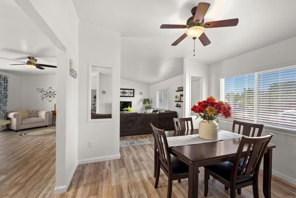 8620 Atlas View Drive Santee, CA 92071 - Photo 19 of 58 a view of a dining room with furniture and wooden floor