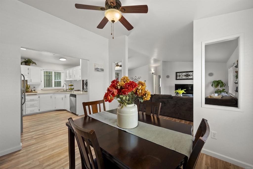 8620 Atlas View Drive Santee, CA 92071 - Photo 22 of 58 a view of a dining room with furniture and wooden floor