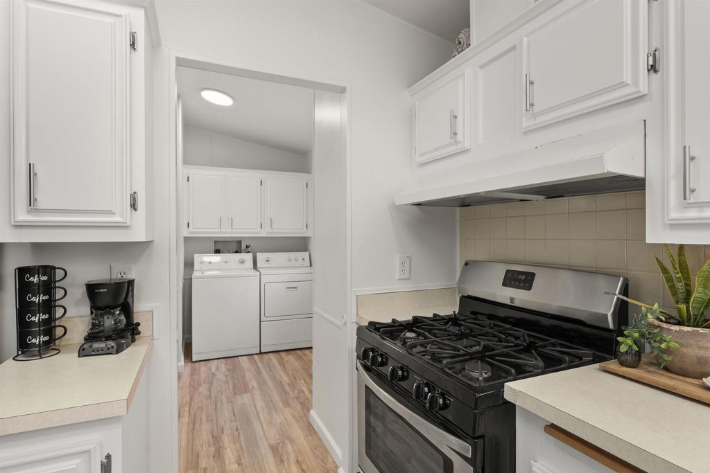 8620 Atlas View Drive Santee, CA 92071 - Photo 28 of 58 a kitchen with white cabinets and appliances