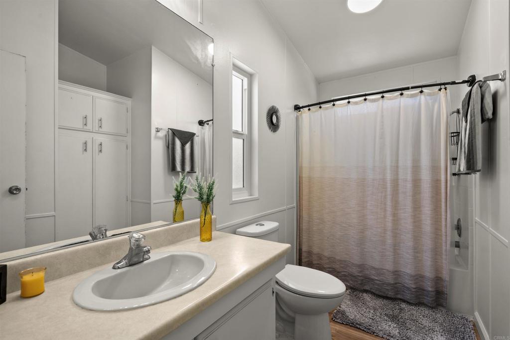 8620 Atlas View Drive Santee, CA 92071 - Photo 34 of 58 a bathroom with a sink toilet and shower