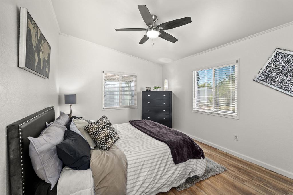 8620 Atlas View Drive Santee, CA 92071 - Photo 35 of 58 a bedroom with a bed and window