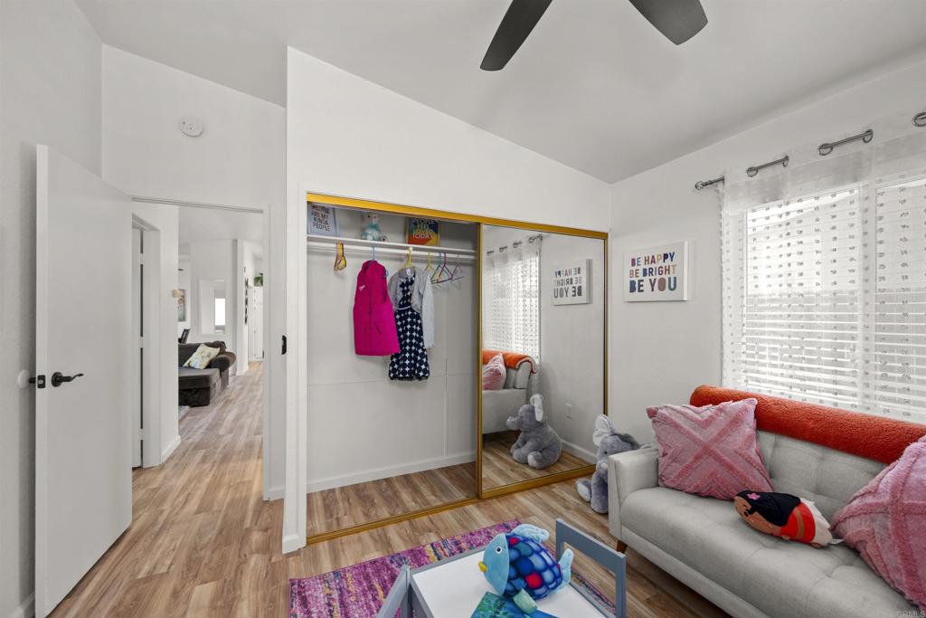 8620 Atlas View Drive Santee, CA 92071 - Photo 39 of 58 a living room with furniture and a wooden floor