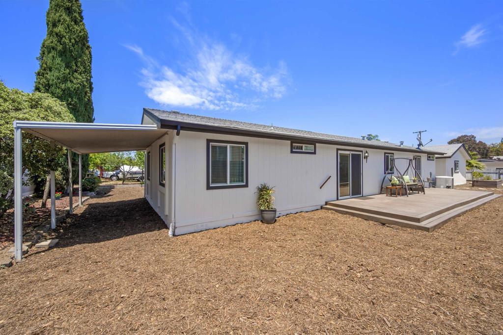 8620 Atlas View Drive Santee, CA 92071 - Photo 43 of 58 a view of a house with backyard and sitting area