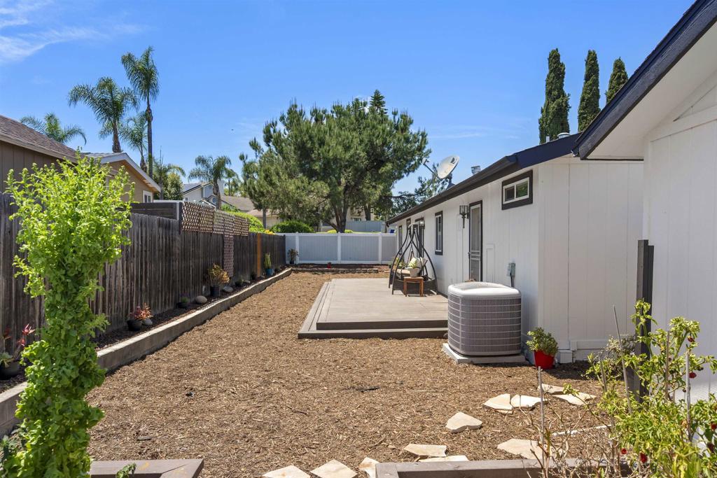 8620 Atlas View Drive Santee, CA 92071 - Photo 50 of 58 a backyard of a house with table and chairs plants