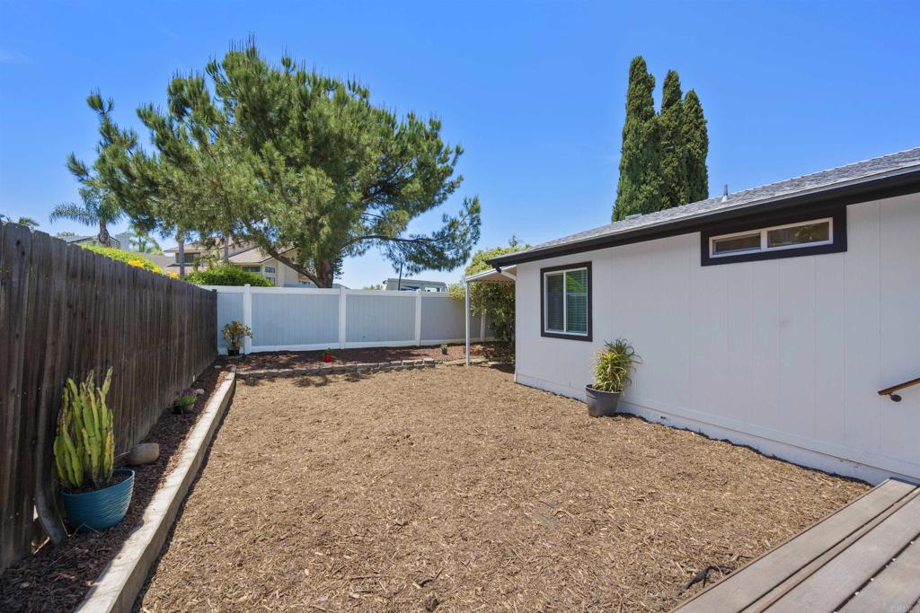 8620 Atlas View Drive Santee, CA 92071 - Photo 51 of 58 a backyard of a house with lots of green space